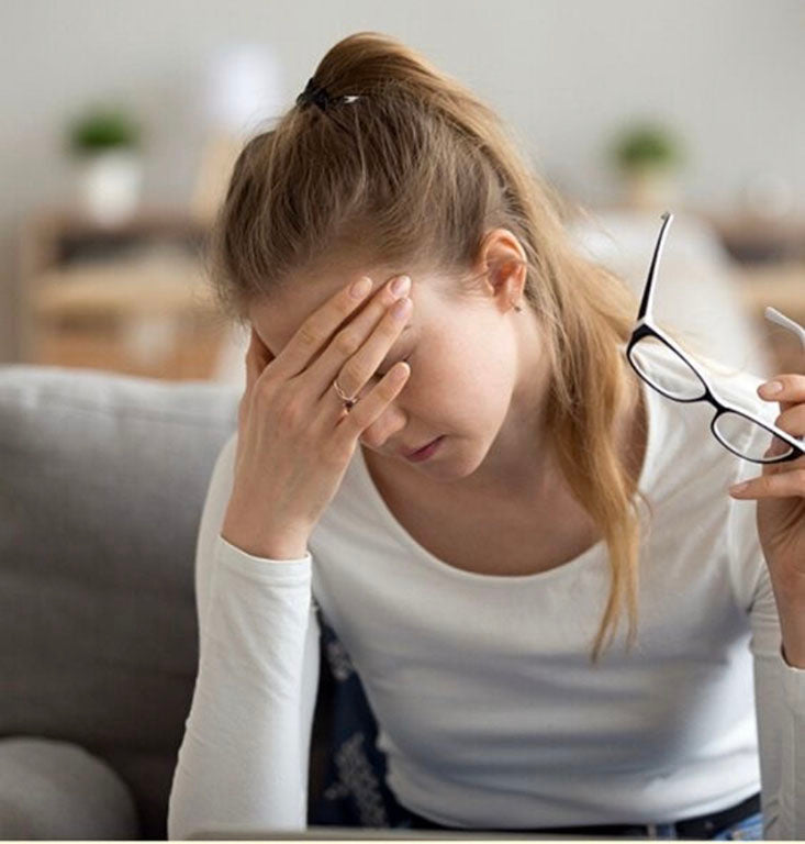 a woman holding her head