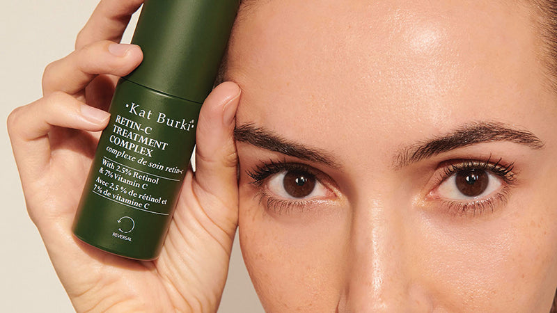 Kat Burki Retin-C Treatment Complex held beside a model's eye